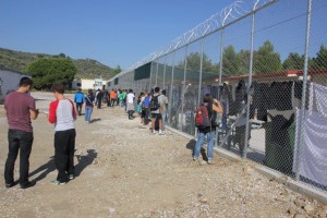 At the fence inside of the detention center. Copyright: Azadi